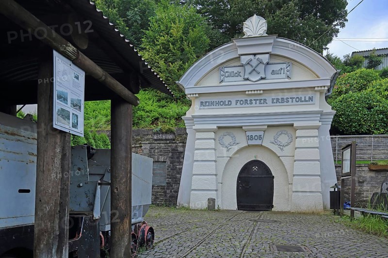 Mouth hole with decorations, year and goods lorry from the Reinhold Forster Erbstollen visitor mine built in 1859, portal, decorations, inscription, luck, on, year, 1805, symbol, mallet and iron, entrance, iron mine, mine, lorry, Erbstolln, mining, lure, Eiserfeld, Siegen, Siegerland, North Rhine-Westphalia, Germany, Europe