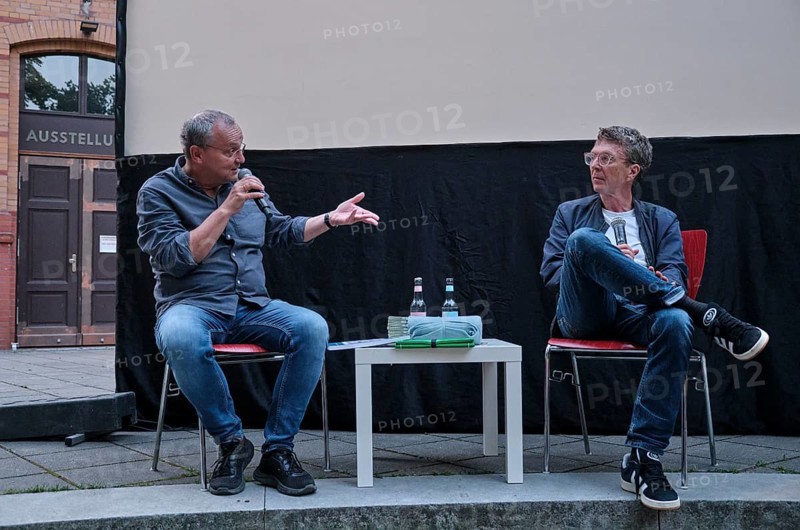 Germany, Berlin, 25.07.2024, Summer in the Courtyard, open-air film series with Knut Elstermann (left), Museum Pankow (Sebastian Haffner Culture and Education Centre), film: Berlin, Ecke Schönhauser (Wolfgang Kohlhaase), with guest Alexander Osang (right), Europe
