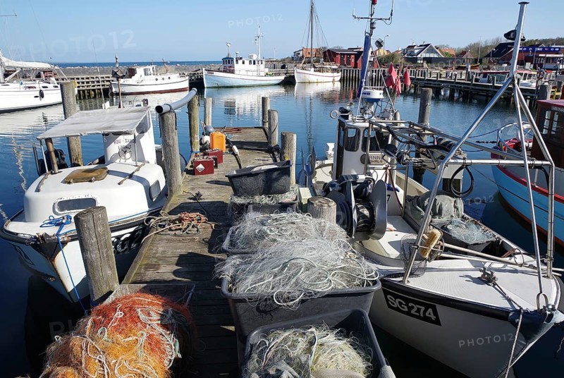 Boats with fishing nets moored in the harbour, a quiet maritime atmosphere, Manor Route, Lohals, Langeland, Denmark, Europe