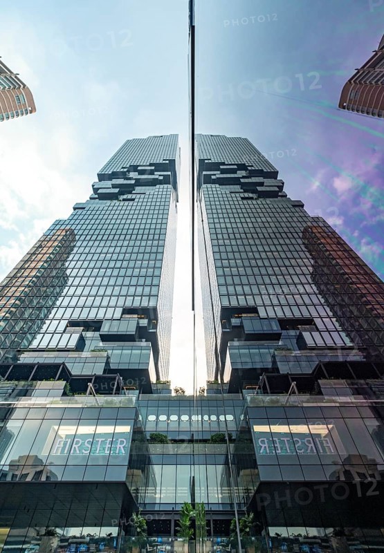Low-angle view of the King Power Mahanakhon building reflected in a window, Bangkok, Thailand, Asia