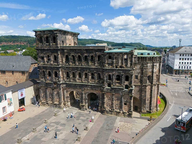 Historical architecture in sunny weather, tourists visiting Porta Nigra in Germany, aerial view, Porta Nigra, Black Gate, Roman city gate, Trier, Rhineland-Palatinate, Germany, Europe