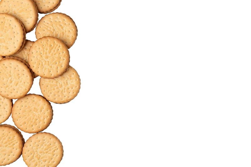 Group of double biscuits at the left edge of the picture, on white, copying room