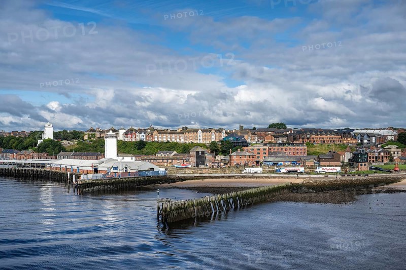 North bank of the River Tyne, fish market on the left with the Old Low lighthouse on the right and the Fish Quay High lighthouse on the left, North Shields, Newcastle upon Tyne, Northumberland, England, United Kingdom, Europe