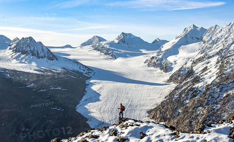 Mountaineer in front of a large glacier tongue, view of Gurgler Ferner with summit Karlesspitze and Hochwilde, Ötztal Alps, Ötztal nature park Park, Tyrol, Austria, Europe