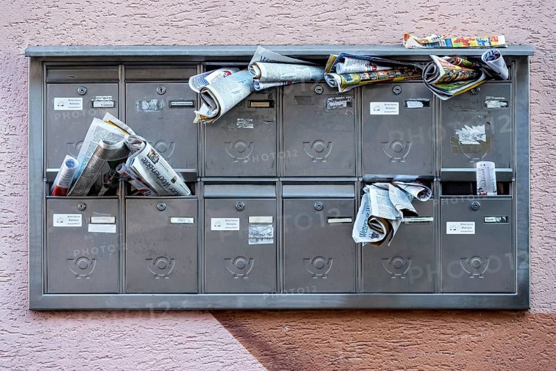 Letterboxes, overfilled, clogged, advertising leaflets, weekly papers, brochures, newspapers, advertising, advertisement, Friedberg, Wetterau, Hesse, Germany, Europe