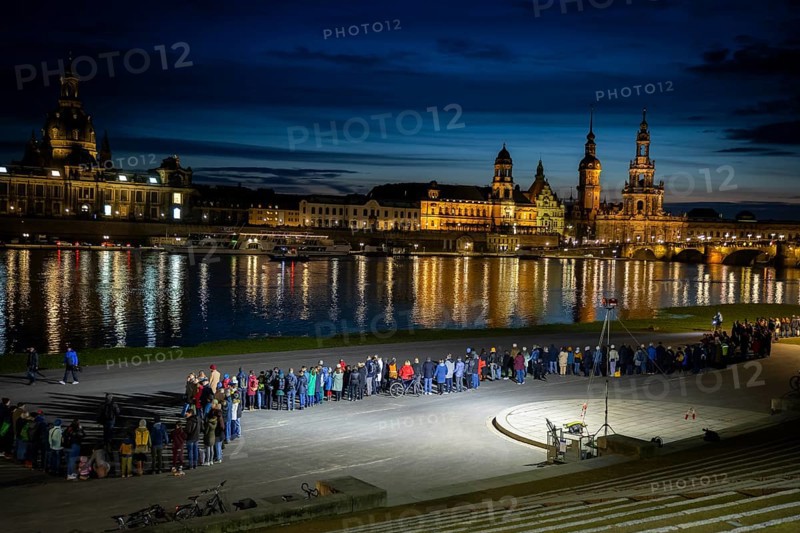 On 13 and 14 February 1945, Dresden was heavily destroyed in three Allied bombing raids. Every year, the people of Dresden commemorate this event at various events. A long human chain symbolised the protection of the city centre. Here looking from the Königsufer across the Elbe to the Old Town, Dresden, Saxony, Germany, Europe
