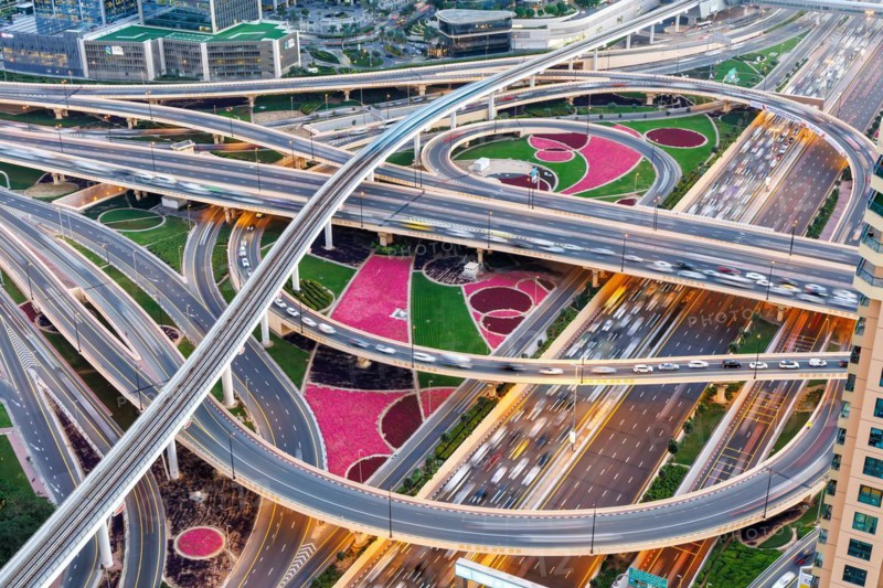 Intersection of Sheikh Zayed Road traffic on the road near the Burj Khalifa with Metro in Dubai, United Arab Emirates, Asia