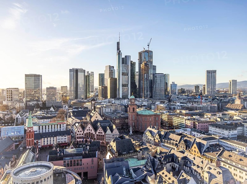 View of the banking district in the evening, skyscrapers of the credit institutions, Mainhatten, in front of it the historic old town with Römer and Paulskirche, Frankfurt am Main, Hesse, Germany, Europe