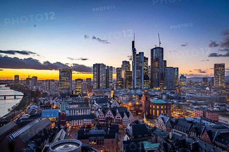 View of the banking district in the evening, skyscrapers of the credit institutions, Mainhatten, in front of it the historic old town with Römer and Paulskirche, Frankfurt am Main, Hesse, Germany, Europe