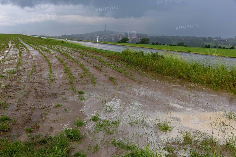 Heavy rain showers and thunderstorms pass over Possendorf in the Eastern Ore Mountains. Flooded fields cause damage to agriculture, Possendorf, Saxony, Germany, Europe