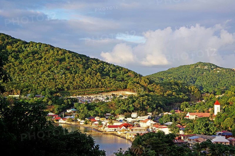 Caribbean, French Antilles, Guadeloupe, Basse-Terre, View of the village Deshaies with harbour, North America