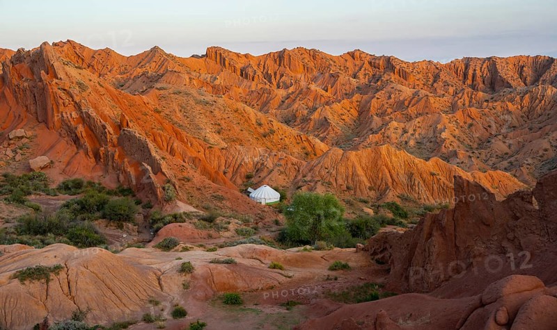 Yurt between red rocks, canyon of eroded sandstone formations, red and orange sandstone rocks, fairytale gorge, Skazka, Tosor, Kyrgyzstan, Asia