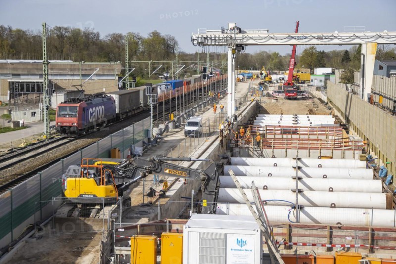 Rastatt Tunnel construction site on the Rhine Valley line with goods train, Deutsche Bahn AG infrastructure project. Construction work began in 2013 and was due to be completed in 2022. Due to an accident involving a tunnel boring machine, the project has been delayed and is now scheduled for completion in 2026, Rastatt, Baden-Württemberg, Germany, Europe