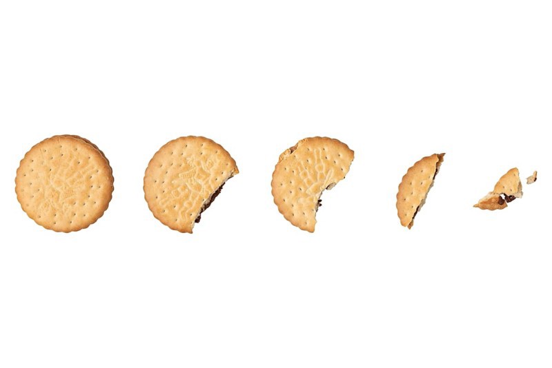 Double biscuit getting smaller by biting off, food photography, white background