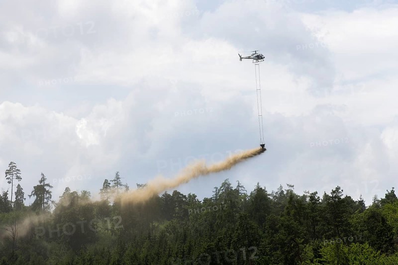 Symbolic image, climate change, helicopter, helicopter spreading fine-painted limestone and ash against acid rain, mixed forest, container, soil protection liming, forest liming, Baden-Württemberg, Germany, Europe