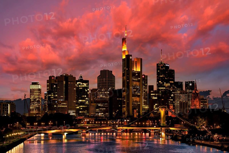 Skyline and banking district against a dramatic cloudy sky, sunset, Taunus Tower, Tower 185, Commerzbank, Messeturm, HelaBa, Hessische Landesbank, Deutsche Bank, Kaiserdom, FlöÃŸerbrücke, Frankfurt am Main, Hesse, Germany, Europe