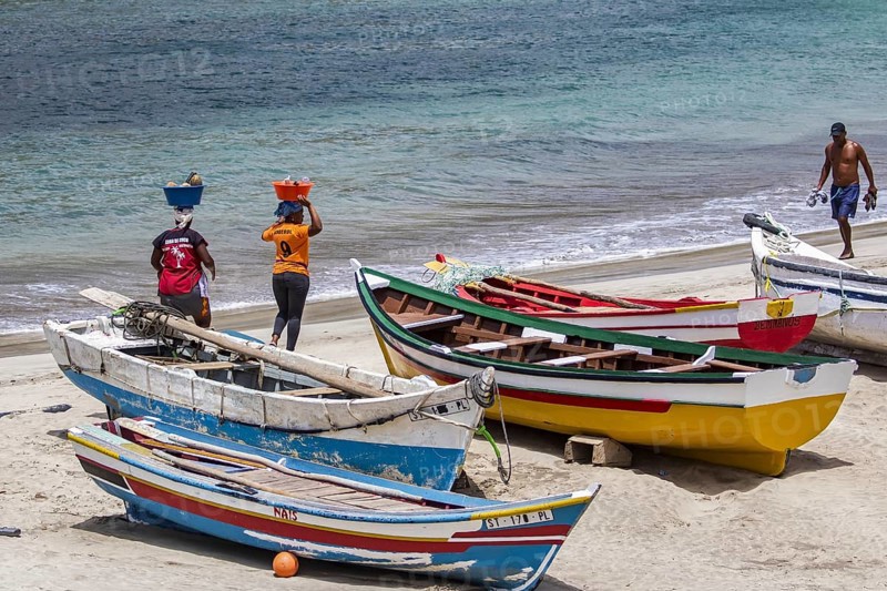Two local Cape Verdean women transporting food on their heads on the beach near Tarrafa on the island Santiago, Cape Verde, Cabo Verde, Africa