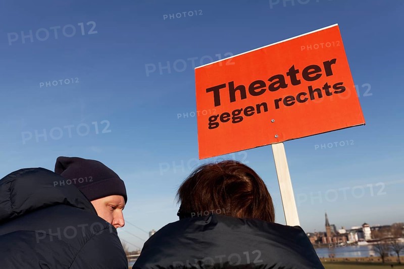 Demonstrators with banner Theatre against the right, large demonstration against right-wing extremism on 27 January 2024 in Düsseldorf, North Rhine-Westphalia, Germany, Europe