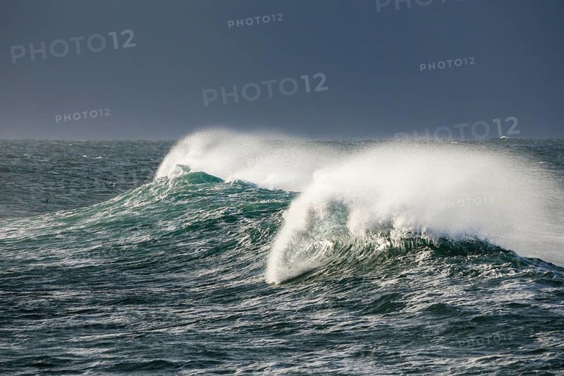 Big wave breaks in the open sea on the Breton coast near Brest, France, Europe