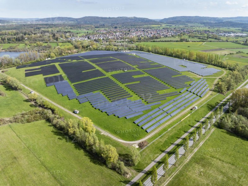 Aerial view, solar modules, solar park, photovoltaics, power generation from solar energy on a former landfill site near Radolfzell on Lake Constance, with the village of Böhringen in the background, district of Constance, Baden-Württemberg, Germany, Europe