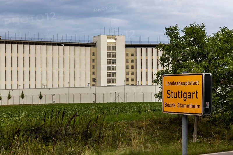 Stammheim Prison, JVA, exterior view of the maximum security prison with prison wall, Stammheim town sign, Stuttgart, Baden-Württemberg, Germany, Europe