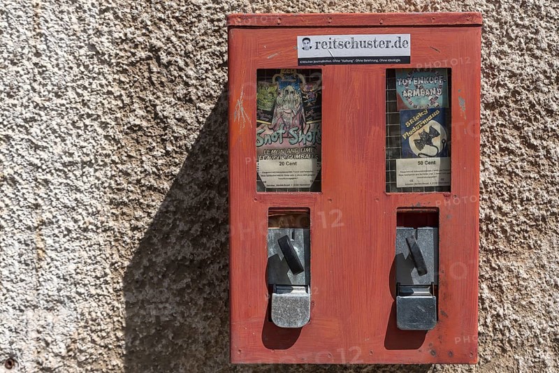 Old chewing gum machine from the 1950s on a house wall, Bavaria, Germany, Europe