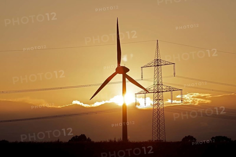 Sunset behind clouds, wind power station, high-voltage pylon, Melbeck, Ilmenau joint municipality, Lower Saxony, Germany, Europe