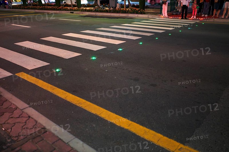Night shot, pedestrian crossing, zebra crossing, against smartphone junkies, with ground traffic lights, ground traffic lights, LED lights red and green in the asphalt, pedestrians, traffic, Dubai, United Arab Emirates, VAR, Asia