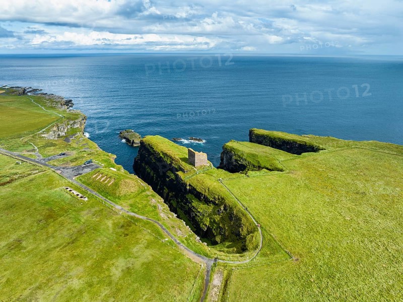 Aerial view of the ruined Castle of Old Wick surrounded by rugged cliffs on the North Sea coast, Wick, County Caithness, Scotland, United Kingdom, Europe