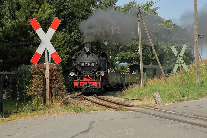 Fichtelbergbahn steam train over ungated level crossing with St. Andrew's cross at station, tourist attraction, smoke, railway track, steam locomotive, Cranzahl, Sehmatal, Erzgebirge, Saxony, Germany, Europe