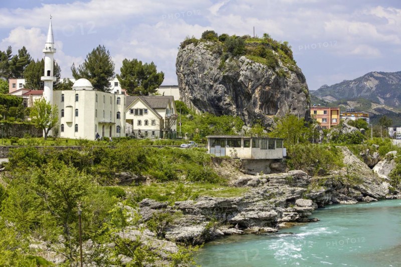 Town view of Përmet with cube-shaped rock Guri i Qytetit with wall remains from Ottoman times. Valley of the Vjosa, the Vjosë is one of the few larger natural rivers in Europe, National Park Wild River Vjosa, Përmet, Qark Gjirokastra, Albania, Europe