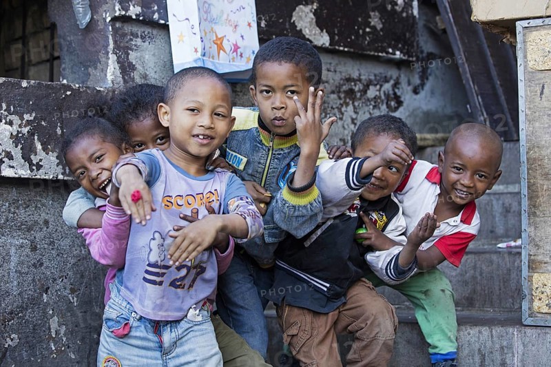 Smiling Malagasy children having fun posing in the streets of Antananarivo, capital city of Madagascar, Southeast Africa
