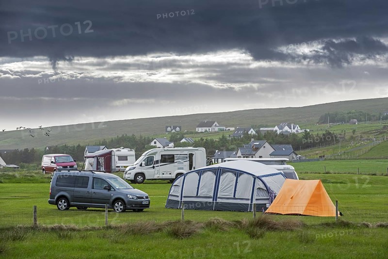 Campervans and tents on campsite along Loch Gairloch, Wester Ross, North-West Scottish Highlands, Scotland, UK