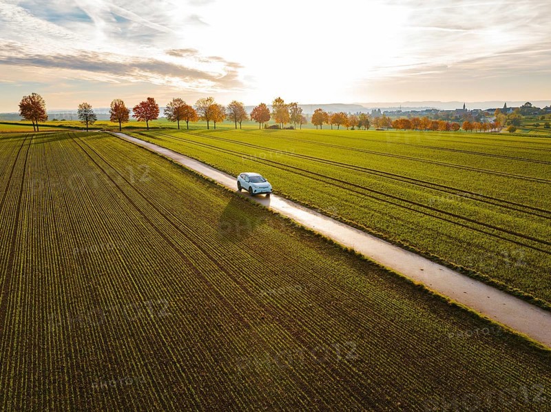 Aerial view of a VW ID4 electric car at sunrise in autumn, Herrenberg, Germany, Europe