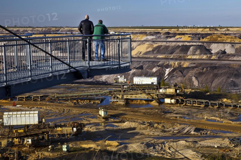 Two men on the Jackerath viewing platform look out over the Garzweiler open-cast lignite mine, Juechen, North Rhine-Westphalia, Germany, Europe