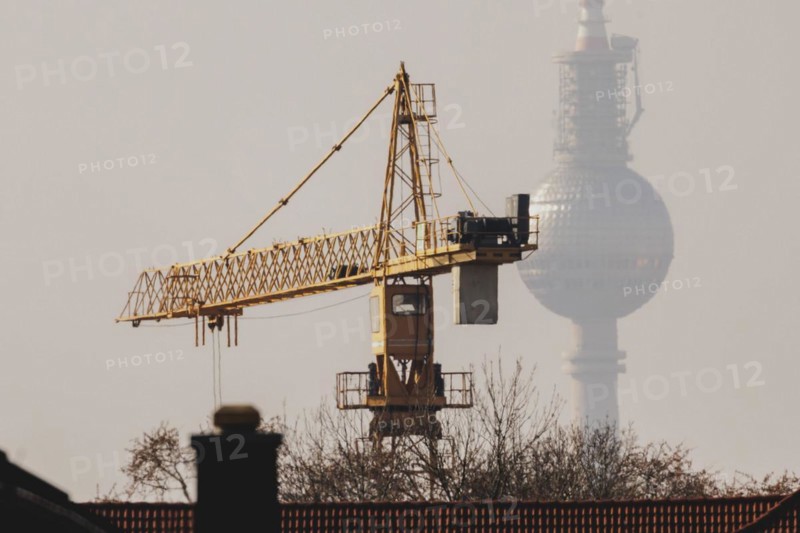 A crane looms in front of the Berlin television tower in Berlin, 29/02/2024