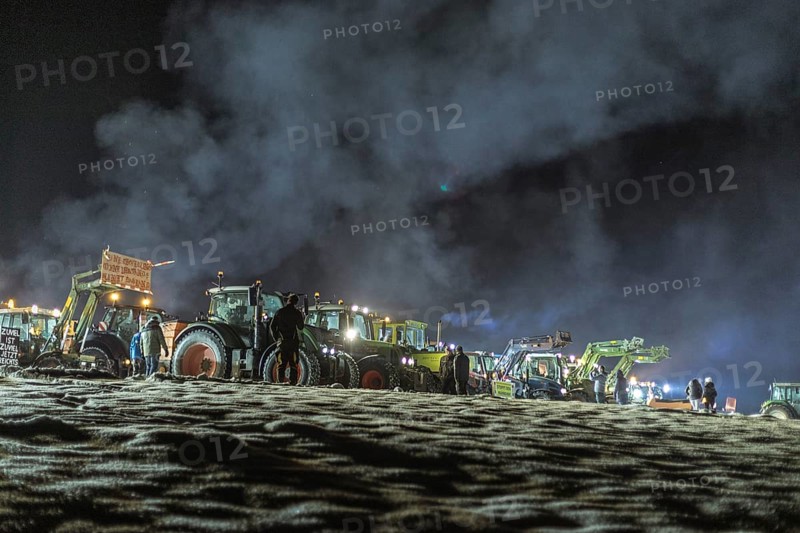 Tractors during a rally as part of the farmers' protests on the snow-covered Kirchbichl, Schliersee, Upper Bavaria, Bavaria, Germany, Europe
