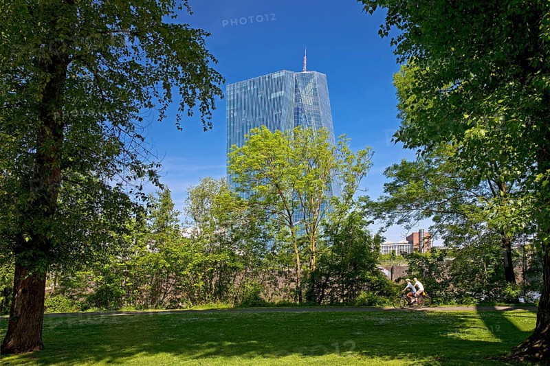 The European Central Bank ECB stands out behind a green park on Deutschherrnufer, Frankfurt am Main, Hesse, Germany, Europe