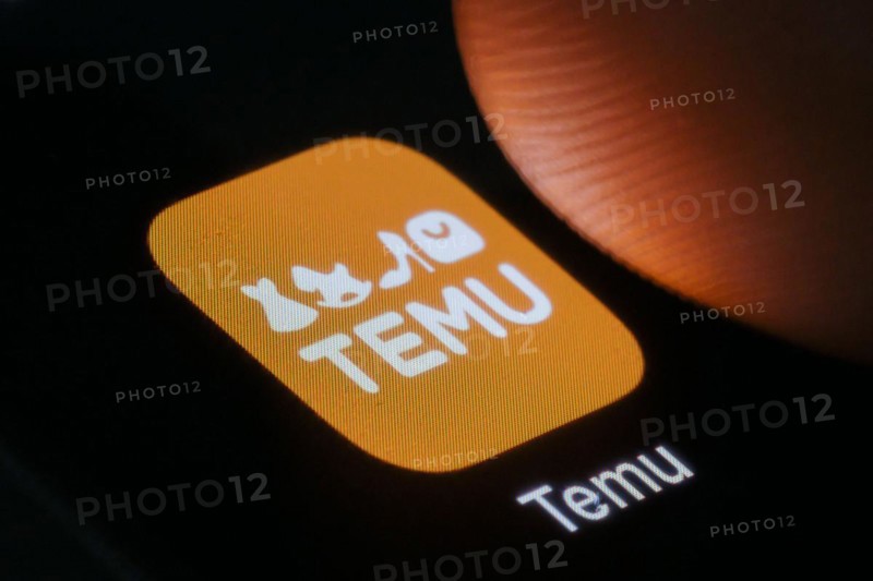 The logo of the Temu app (online marketplace) from Chinese company PDD Holdings can be seen next to a finger. Berlin, 27.03.2024