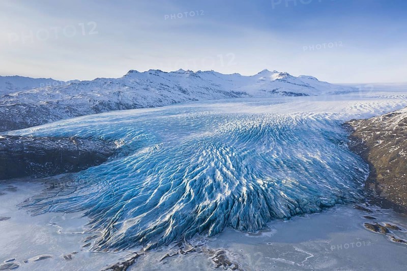 Aerial view over ice tongue Falljökull in winter, one of many outlet glaciers of Vatnajökull, Vatna Glacier, largest ice cap in Iceland, Austurland