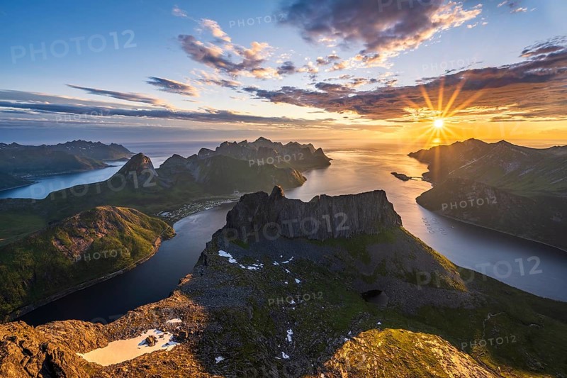 View over Senja's fjords and mountain peaks under the midnight sun, Mount Grytetippen, Senja, Norway, Europe