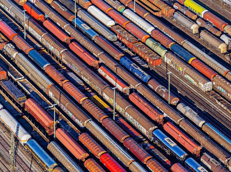 Deutsche Bahn AG marshalling yard. Many goods trains are parked on the tracks with tank wagons, car transporters and other wagons, companies transport a considerable part of their freight by rail, aerial view, Germany, Europe