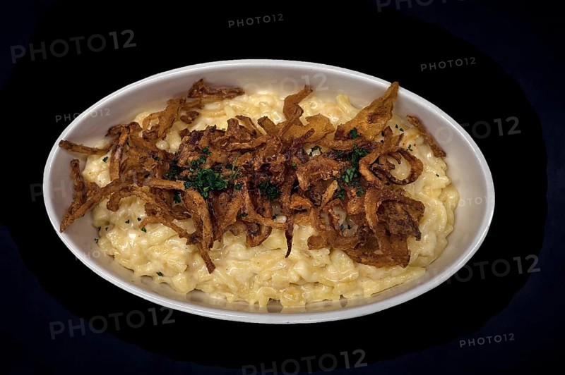 Cheese spaetzle with fried onions on a dark background, Bavaria, Germany, Europe