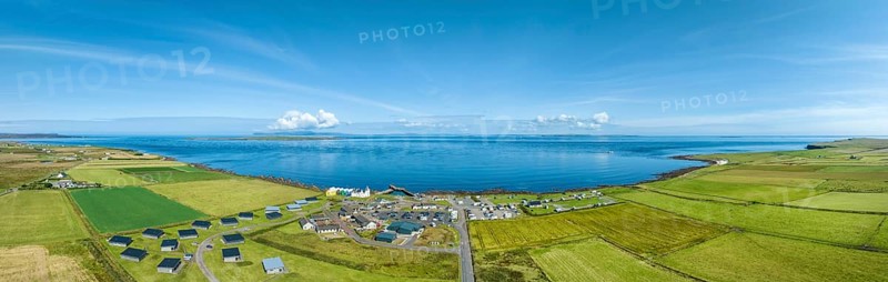 Aerial panorama of the village of John o' Groats, the north-easternmost point of Great Britain with campsite, tourist centre and holiday village, County Caithness, Scotland, Great Britain