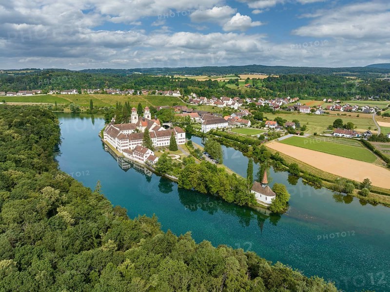 Aerial view of the former Benedictine abbey with the monastery church of St. Mary and the pointed church of St. Magdalena on the Rhine island of Rheinau, Andelfingen, Canton Zurich, Switzerland, Europe