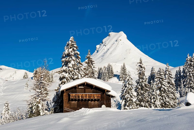 Snow-covered mountains and mountain hut with ski slope, Damülser Mittagspitze, Damüls, Bregenzerwald, Vorarlberg, Austria, Europe