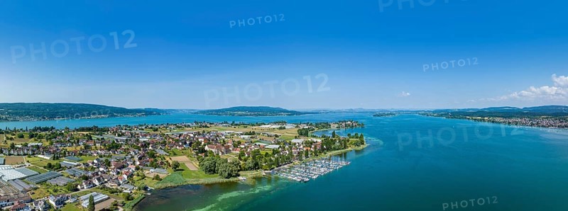 Aerial panorama of the western part of the island of Reichenau, on the horizon from the left the Thurgauer Seerücken, the Höri peninsula, the Hegauberge mountains, the Mettnau peninsula and the Bodanrück ridge, Constance district, Baden-Württemberg, Germany, Europe