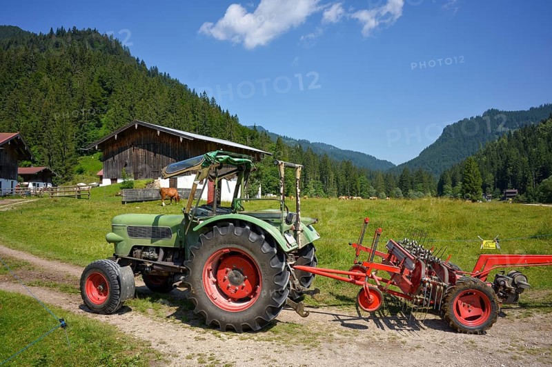 Old Fendt Famer 2 tractor with Pöttinger hay caterpillar at Rötelmoosalm in Bavaria, Germany, Europe