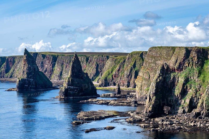 Rugged coastal landscape with the Duncansby Stacks on the coast of Duncansby Head, County Caithness, Scotland, Great Britain
