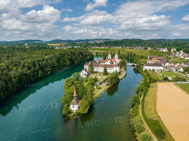 Aerial view of the former Benedictine abbey with the monastery church of St. Mary and the pointed church of St. Magdalena on the Rhine island of Rheinau, Andelfingen, Canton Zurich, Switzerland, Europe